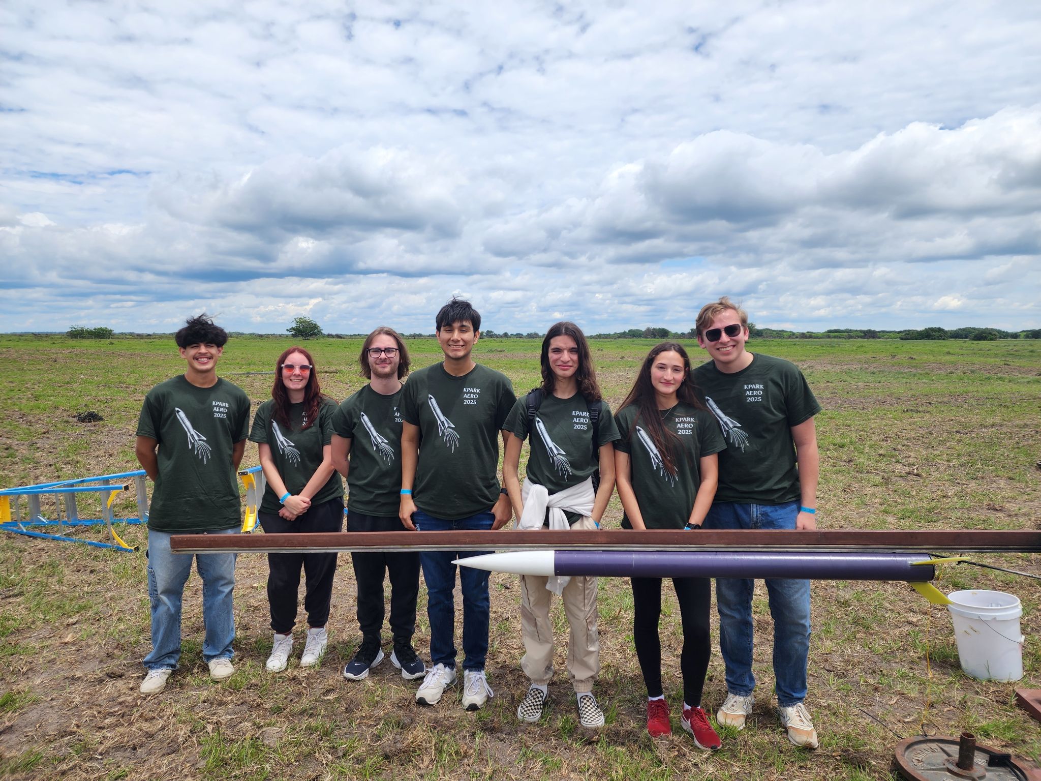Shaleen with a student and rocket at SystemsGo